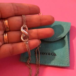 Silver infinity necklace by Tiffany & Co